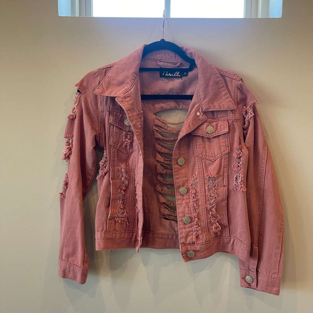 Pink distressed denim jacket